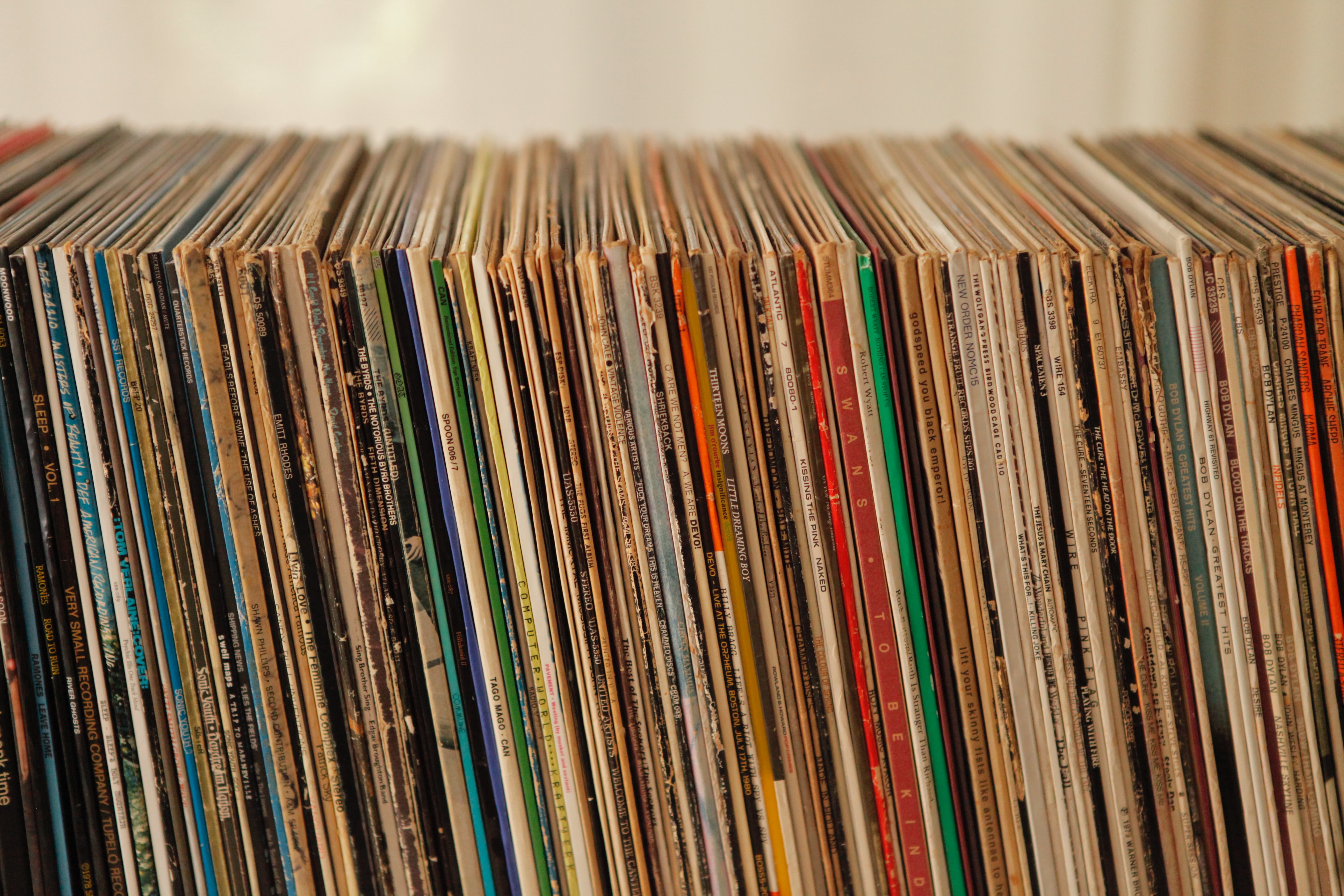 A horizontally stacked record collection